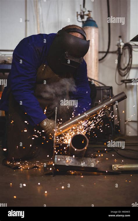 Welder welding a metal Stock Photo - Alamy