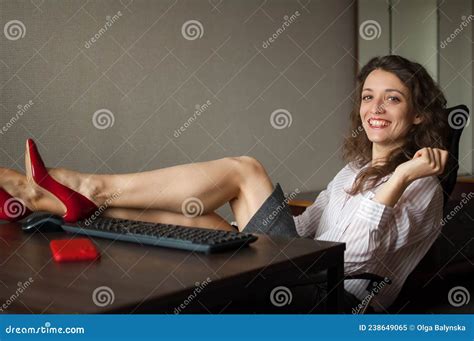 Portriat Of Brunette With Legs On Office Table With Laptop Hot Woman In Red Shoes On High Heels