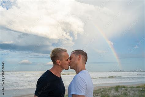 Gay Couple Kissing With Rainbow At Beach Medium Shot Stock Photo Adobe Stock