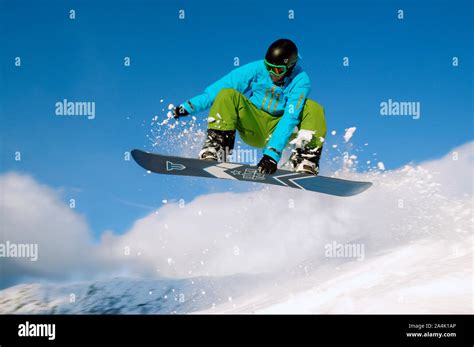 male snowboarding  mountain action shot stock photo alamy