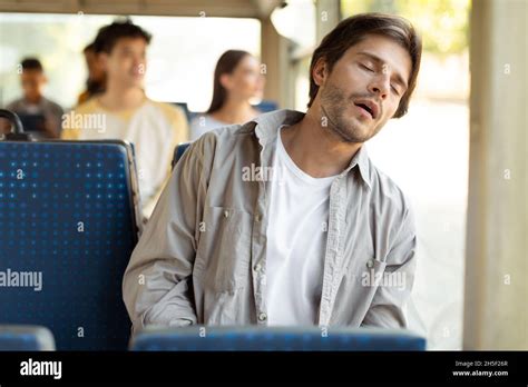 Portrait Of Tired Guy Sleeping In Bus Stock Photo Alamy