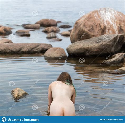Nude Woman Enjoying Nature Among Stones By The Sea Stock Image Image Of Body Outdoors