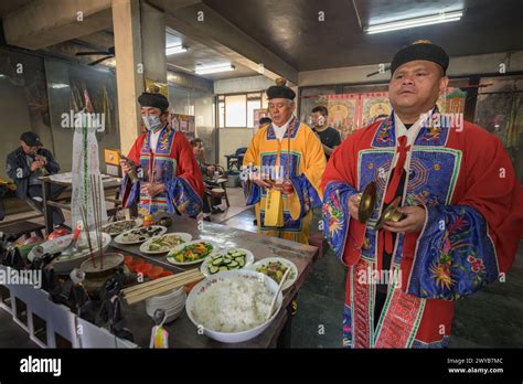 A Traditional Shaman Performing A Ritual With Offerings To The