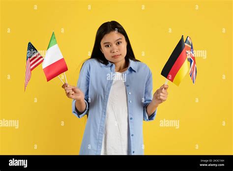 Sad Confused Young Chinese Female Student In Casual With Many Different
