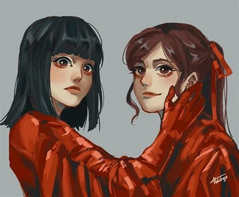 Two Women In Red Jackets Are Facing Each Other And One Is Holding Her