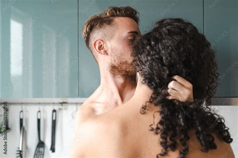 Passionate Moment Shirtless Gay Couple With Different Hairstyles Kissing In Kitchen Stock Photo