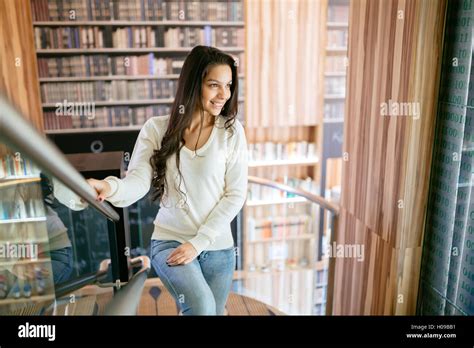 Beautiful Brunette Posing In Library Stock Photo Alamy