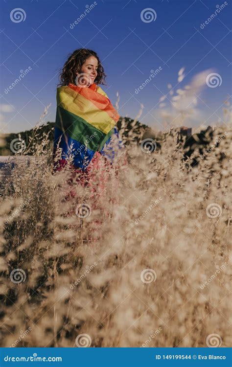 Woman Holding The Gay Rainbow Flag At Sunset Happiness Freedom And Love Concept For Same Sex