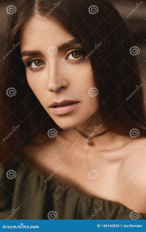 Portrait Of Beautiful Brunette Model Girl With Deep Green Eyes And With Gentle Makeup In