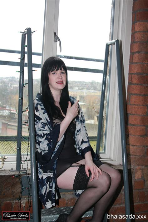 Lovely Brunette Girl Posing In Sexy Black Stockings Photos