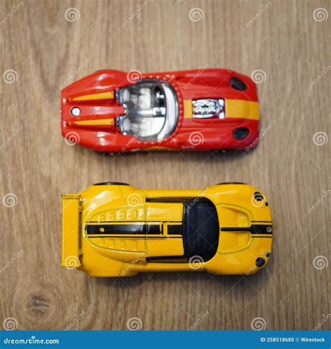 Top View Of The Lotus Sport Elise And Glory Chaser Mattel Hot Wheels Toy Cars On A Wooden