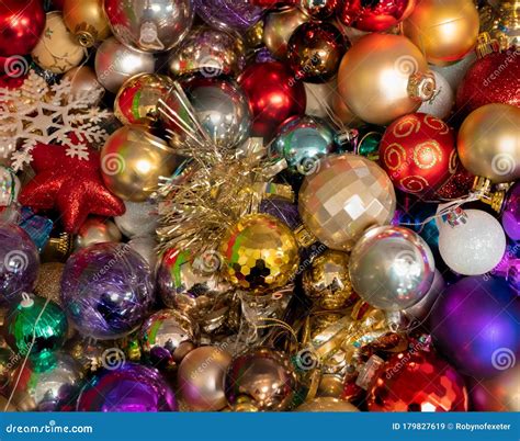 Collection Of Multicoloured Christmas Baubles And Tinsel For Decorating