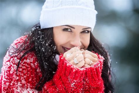 Freezing Female Brunette Smiles At The Camera Holding Frozen Hands Together Stock Image Image