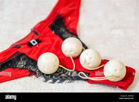 Female Red Bikini Panties And Sex Toy Four Vaginal Balls For Sensual Satisfaction Stock Photo