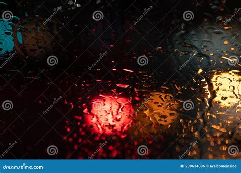 Raindrop Window Night Bokeh. City View through a Window on a Rainy ...