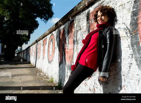 Gorgeous Brunette Woman Posing With Graffiti On The Street Stock Photo Alamy
