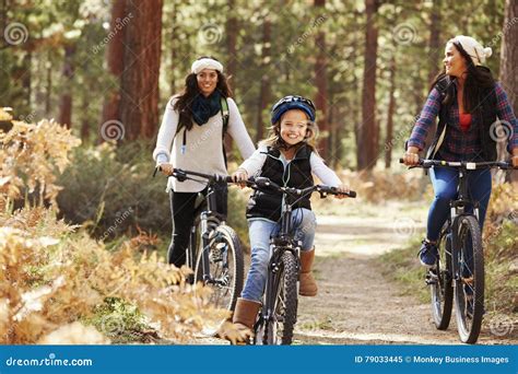 Lesbian Couple Cycling In A Forest With Their Daughter Stock Image Image Of Happy Copy