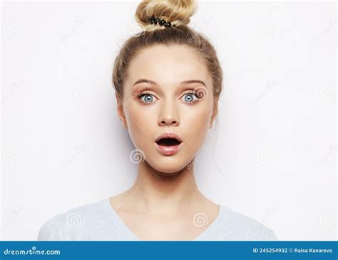 Indoor Shot Of Stupefied Shocked Blonde Woman Keeps Mouth Widely Opened Looks At Camera Stock