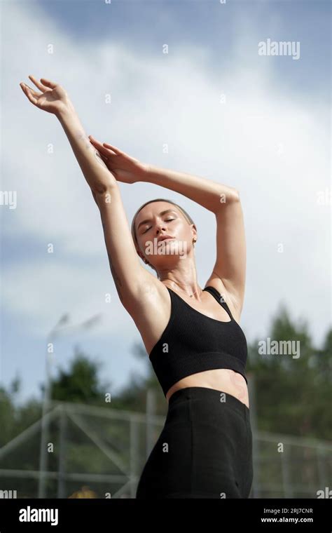 Blonde Fitness Model Stretching Outdoors Stock Photo Alamy