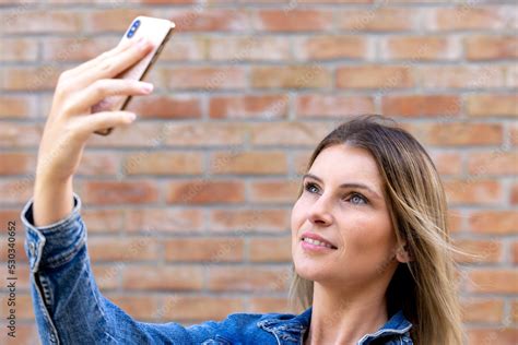 Sexy And Cute Charming Nice Beautiful Attractive Woman With Blonde Pale Skin Taking Selfie With