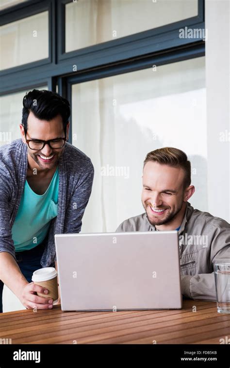 Happy Gay Couple Using Laptop Stock Photo Alamy