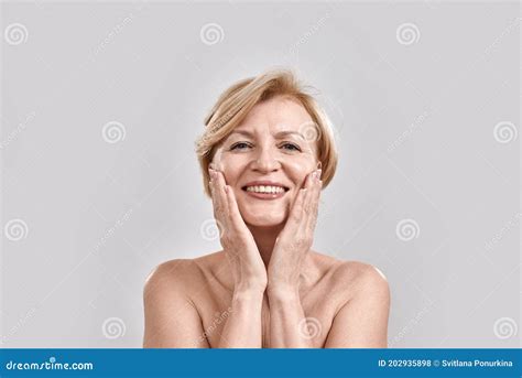 Portrait Of Beautiful Naked Middle Aged Woman Looking Excited At Camera