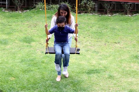 4 Year Old Latina Girl Swims In The Pool With An Inflatable Float Toy Very Happy Enjoying Her