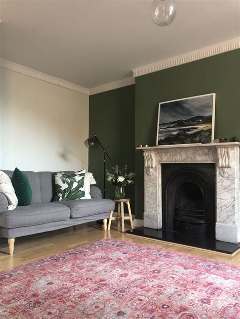 A Living Room Filled With Furniture And A Fire Place Next To A Painting