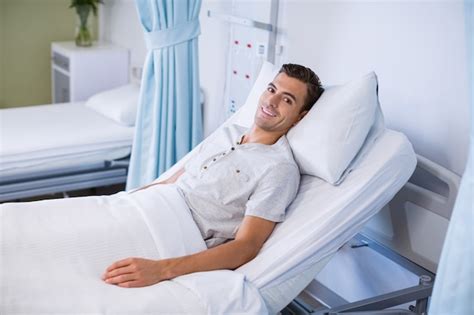 Premium Photo Portrait Of Patient Lying On Bed In A Hospital