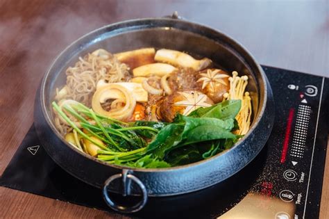 Premium Photo Sukiyaki Hot Pot With Boiling Vegetables