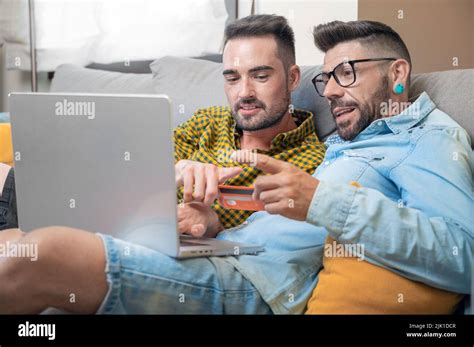 Happy Gay Couple Using Laptop Hi Res Stock Photography And Images Alamy
