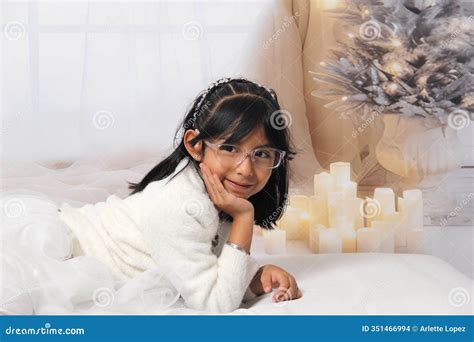 Year Old Latina Girl With Eyeglasses Among Decorated Trees Is Excited To Celebrate Christmas
