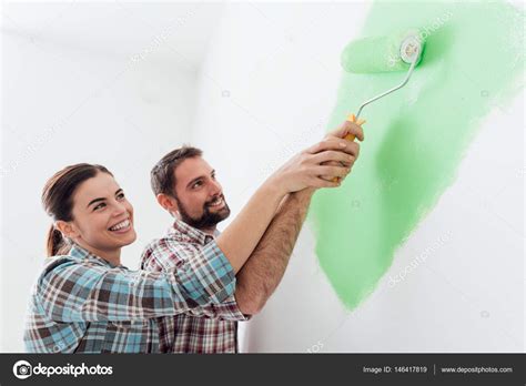 Loving Couple Painting Together — Stock Photo © Stokkete 146417819