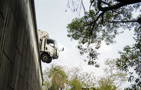Hong Kong driver and helper lucky to be alive after truck crashes ...