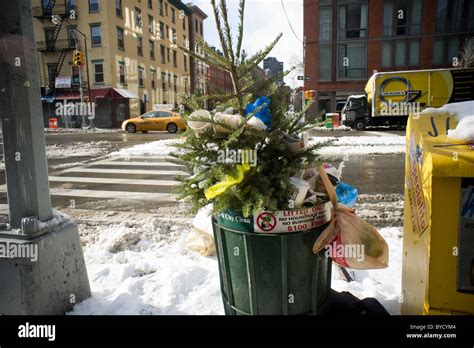 An Overflowing Trash Can Is Seen In The New York Neighborhood Of Stock