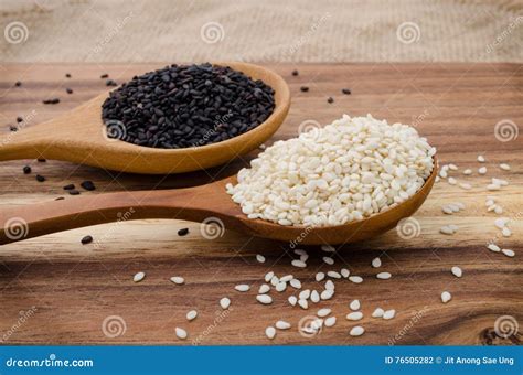 Sesame Seed In Wooden Spoon Black And White Sesame Set Up On Wo Stock