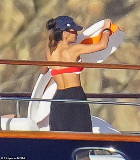 Lauren Sanchez soaks up the sun in a red bikini aboard fiancé Jeff Bezos MILLION