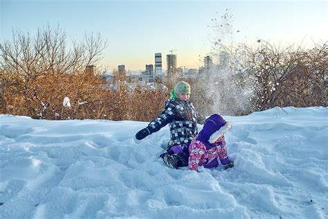 Two Kids Playing on the Snow · Free Stock Photo