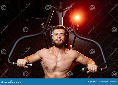 Shirtless Strong Bodybuilder Training Biceps In Gym Dumbbells