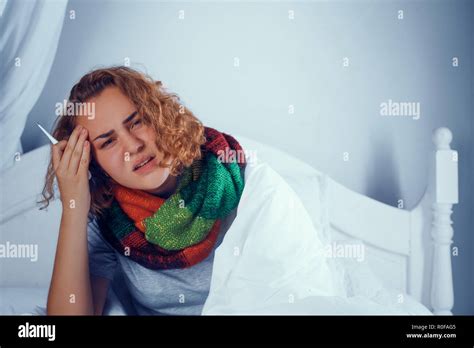 Sick Blonde Girl Is Scarf Touches Her Head In Bed Stock Photo Alamy