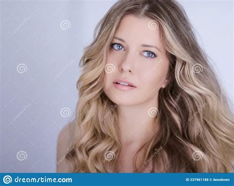 Beauty Hair Care And Natural Makeup Look Beautiful Woman With Long Blonde Wavy Curls Hairstyle