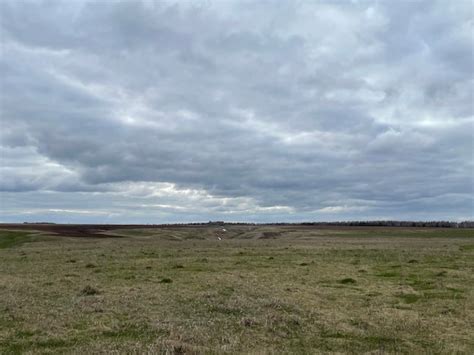 Premium Photo Thunderclouds And Spring Fields With Hills