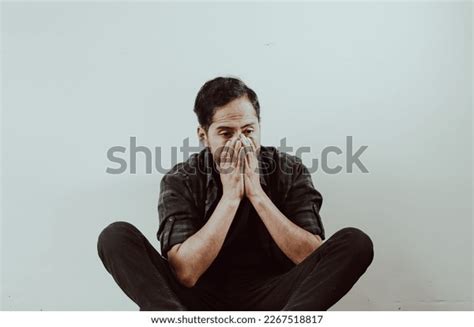 photo person sitting leaning  wall stock photo