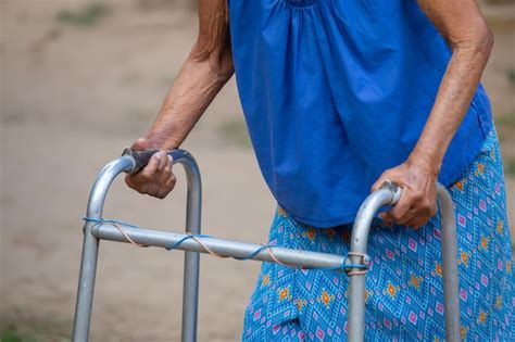 Premium Photo Close Up Elderly Woman Hand Using A Walking Frame An