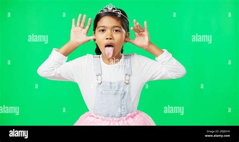 Princess, funny face and girl on green screen in studio isolated on ...