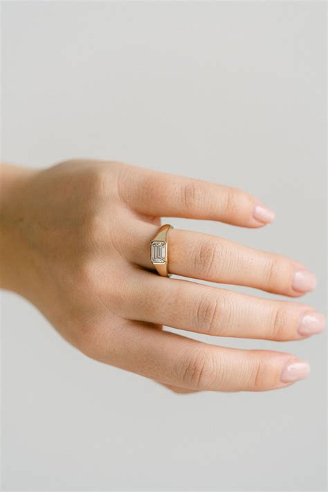emerald cut east west ring 6