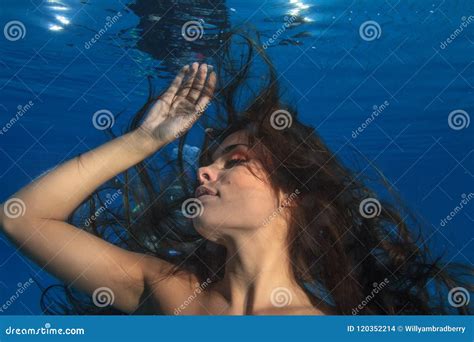 Fashion Brunette Model With Long Hair Underwater On Blue Backgro Stock Photo Image Of Blue