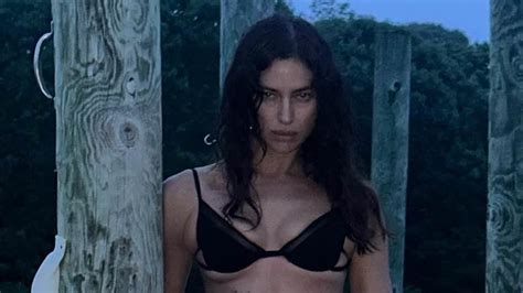 Irina Shayk Shows Off Her Incredible Figure In A Black Bikini While Posing For Sultry Lakeside