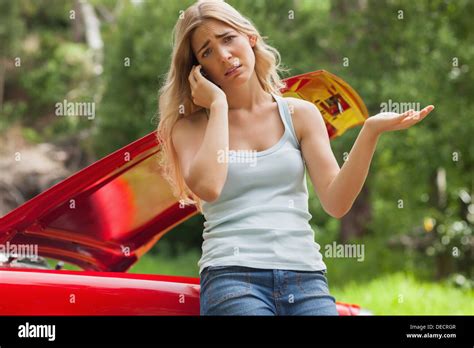 Desperate Blonde Calling For Assistance After Breaking Down Stock Photo Alamy