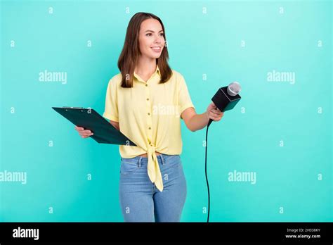 Photo Of Cute Millennial Brunette Lady Take Interview Hold Paper Wear Yellow Top Jeans Isolated